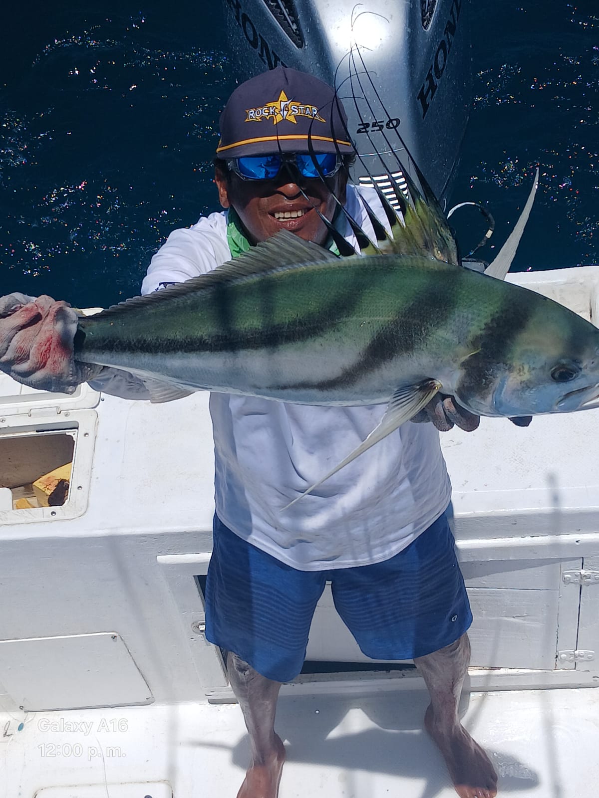 Captain with a roosterfish