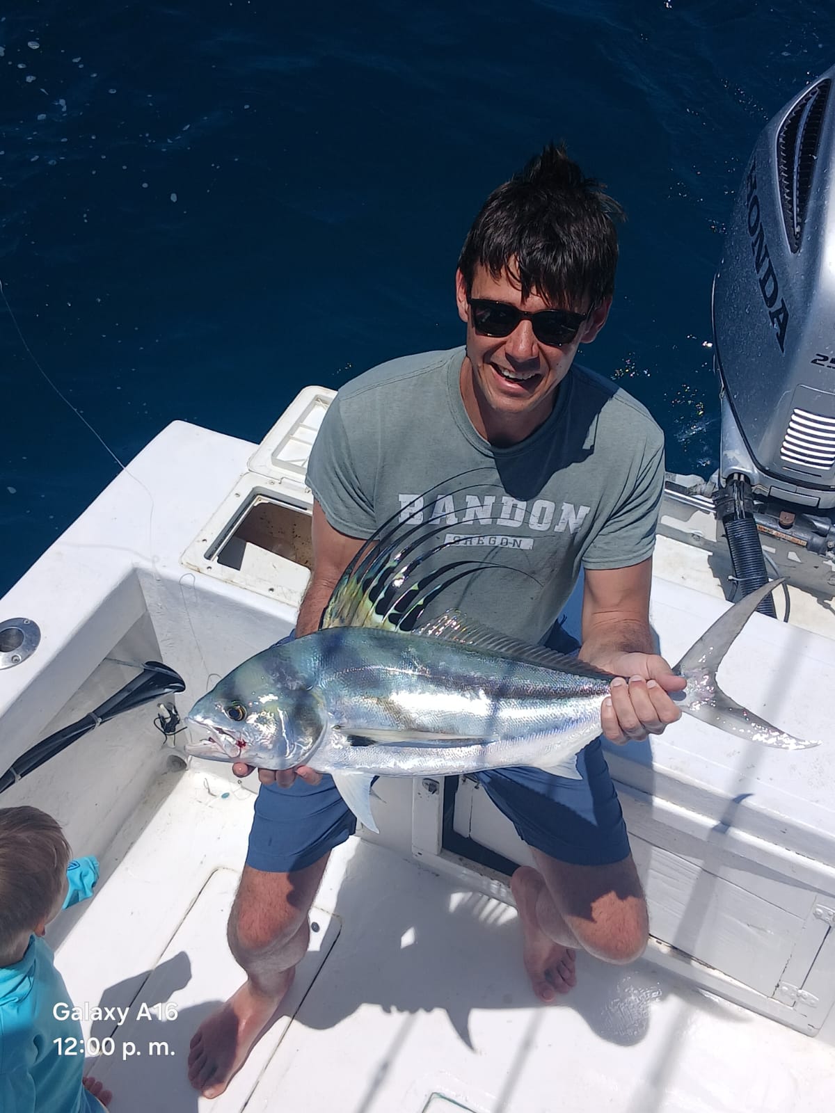 Angler with a roosterfish